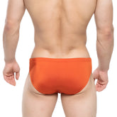 Bright orange metroMaleWear versity swim brief made of smooth stretchy fabric for comfortable swimming use