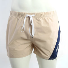 Beige and navy blue MetroMaleWear Viena athletic swim shorts with white drawstring waistband for active use