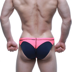 Bright pink and navy blue swim bikini by metromalewear with bold color-block design for vibrant beachwear