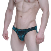 Tealm and black patterned swim trunks with a tropical leaf design from MetroMaleWear Zafiro Bikini 5103-M67