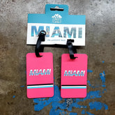 Bright pink rectangular miami luggage tags set of 2 with bold white text and black light blue turquoise stripes
