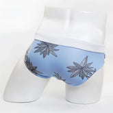 Light blue men’s briefs with white waistband and black and gray cannabis leaf pattern from MIIW floral beach bikini swimwear