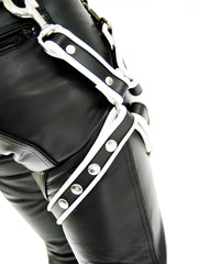 Black leather leg harness with white trim and silver metal hardware by mister b in size l/xl displayed from the front