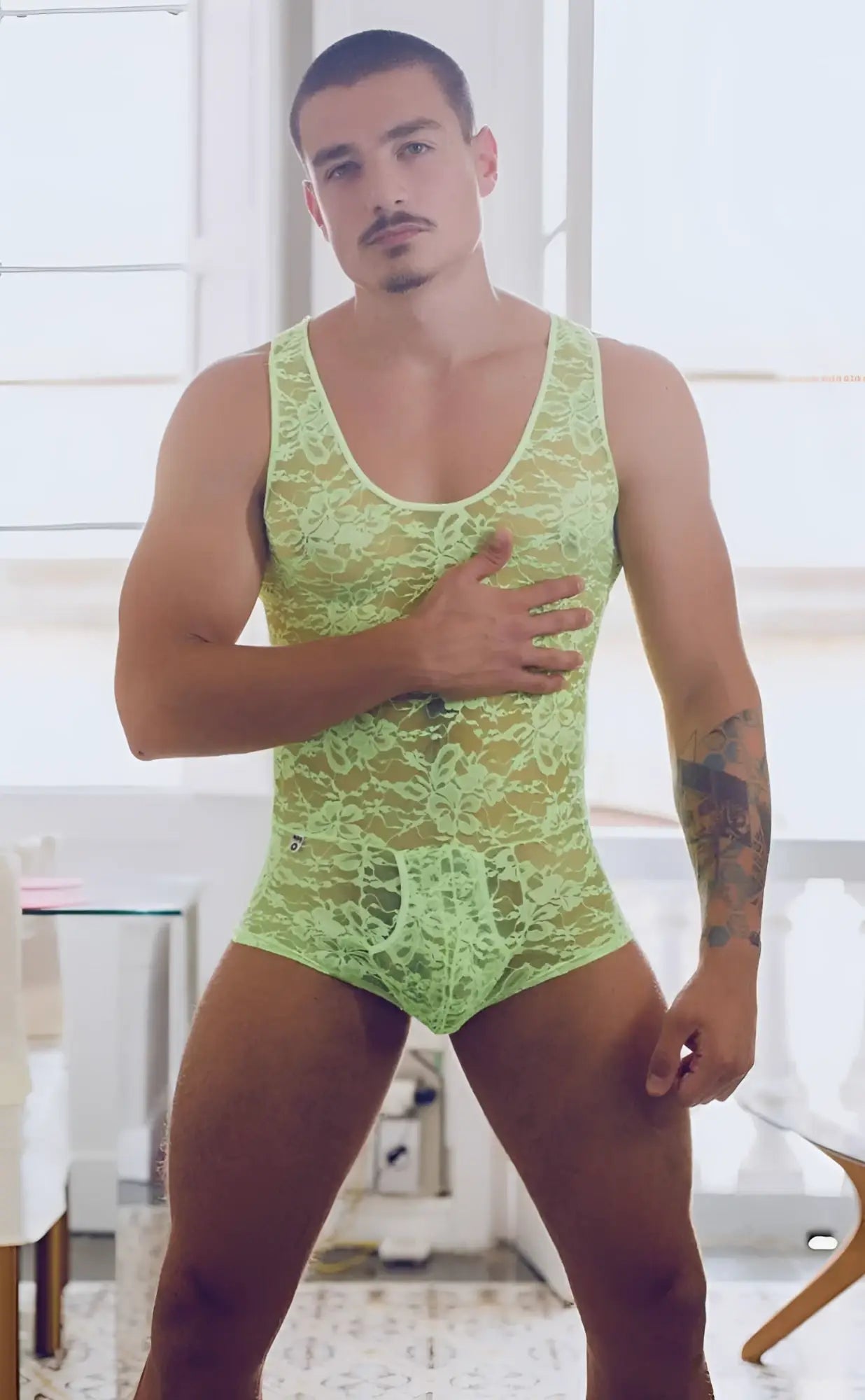 MOB men’s lace bodysuit in lime green with intricate floral patterns made of delicate lace material