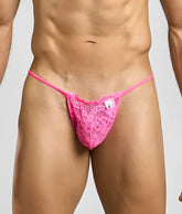 MOB men’s lace thong in bright pink with delicate floral patterns and a small white brand tag