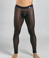 Black sheer mesh tights with solid waistband and reinforced seams from mob for a sleek stylish look