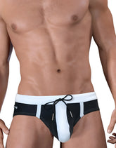 Black and white Moby Big Boy Pouch swim trunks with drawstring waistband designed for comfortable swimwear use