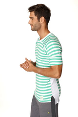 A man wearing a green and white stripe nautical raglan resort henley tee with short sleeves and crew neck