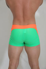 Neon curved sq cut trunk vibrant neon green and orange snug athletic shorts designed for performance and comfort