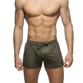 Nexus button shorts olive green athletic shorts with white side stripes and drawstring waistband for activewear