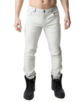 Light gray slim-fit denim jeans with classic five-pocket design and rolled cuffs from NP JEAN bleached collection