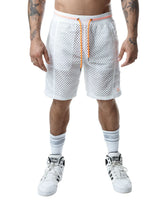 A model wearing Nasty Pig white mesh shorts with vibrant orange drawstrings against a white background.