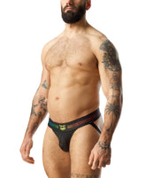 Bearded tattooed man modeling Nasty Pig Prism Pride black mesh jockstrap underwear with rainbow waistband.