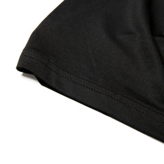 Black cotton t-shirt sleeve with neatly stitched hem on nylon active underwear tank top for comfortable support