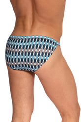 Rear view of a man wearing Olaf Benz blue print riotanga underwear with an abstract leaf pattern.