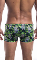 Oceanico square cut swim trunks in green and black with vibrant tropical leopard and foliage pattern