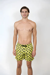 Bright yellow octopus print swim shorts with repeating black pattern perfect for beach and pool use