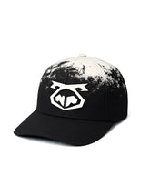 Black oxidize snout cap with white splatter paint effect and bold geometric logo on the front for casual wear