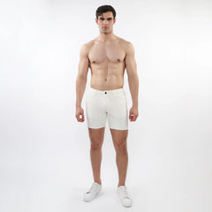 White parquet jacquard stretch knit shorts with a sleek minimalist design and a single black button at the waistband
