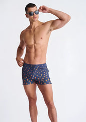Peacock feathers seersucker swim shorts in blue with a pattern of orange and yellow ice cream cones and mesh lining