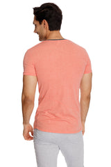 A coral-colored perfect pocket crew-neck tee with short sleeves heathered texture and black neckline trim