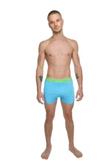 Light blue boxer briefs with bright green elastic waistband designed for comfort and performance during yoga workouts