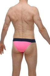 Bright pink petitq bikini coren pink swim trunks with contrasting navy blue waistband for beachwear