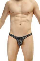 Black thong with white heart pattern from petitq bikini dumbo coeur collection showing front side design