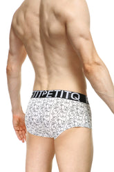 White petitq boxer visage briefs with black line art faces and bold white brand name on elastic waistband