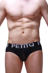 Black petitq brief vic with sheer front panel and white lettering on the waistband for men