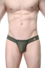Olive green mesh thong with subtle textured pattern and small pink logo tag on waistband petitq mini boxer cheek bee sage