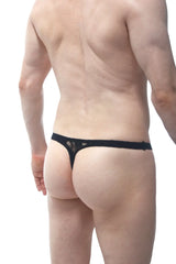 Black lace thong from PetitQ with a solid band and delicate floral pattern shown from the back side