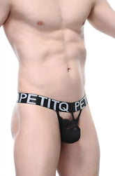 Black lace thong with wide elastic waistband featuring petitq brand name in white lettering from PetitQ Thong Lace Fismes