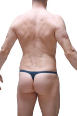 Navy blue PetitQ thong Yutz Prussian with a simple seamless design showing the back side of the product