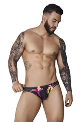 Black pikante pik 1076 nucleus jockstrap with vibrant pink and yellow abstract designs on swim trunks material
