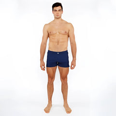 Navy blue pinstripe swim short with a single white button at the waistband for casual beachwear