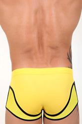 Bright yellow pistol pete atomic midcut square cut trunk swimwear with black mesh panels and trim in size small