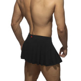 Black pleated ring skirt with a red logo on the waistband made from lightweight fabric for stylish wear