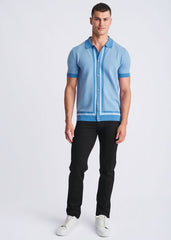 Light blue short-sleeved honeycomb textured knit polo shirt with subtle geometric pattern and darker blue trim
