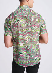 A lightweight cotton silk short-sleeved shirt with a vibrant green pink and white psychedelic swirling pattern