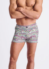 Swirls print seersucker swim shorts with mesh lining featuring vibrant pink green and white wavy abstract patterns