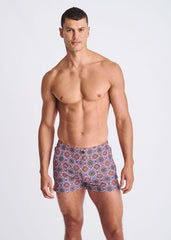 Medallions seersucker swim shorts with mesh lining in vibrant purple red and blue geometric pattern for men
