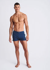 Navy blue riviera seersucker swim shorts with mesh lining and single button closure at the waistband