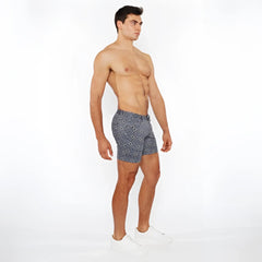 Navy blue printed stretch knit swim trunks with white geometric pattern for comfortable water activities