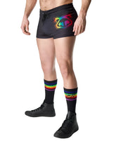 Black prism pride trunk short with vibrant rainbow logo on front featuring moisture-wicking fabric