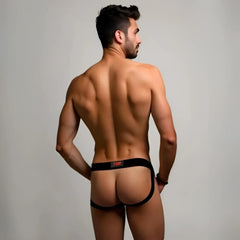 Black ydp brand prowlerr switch jockstrap briefs with a red logo waistband shown from the back side