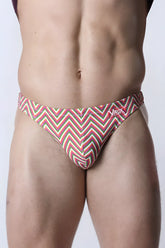 Vaux pulse swim thong men’s swim trunks with bold red green and white zigzag pattern for beachwear