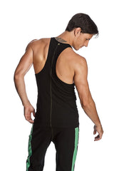 Back view of a black racer-back yoga tank with central zipper paired with matching pants with green side stripes