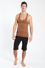 A man wearing a chocolate brown fitted racer-back yoga tank with scoop neckline and black shorts