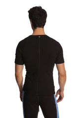 Back view of a black raglan virtual crew neck athletic shirt with a central zipper designed for active wear